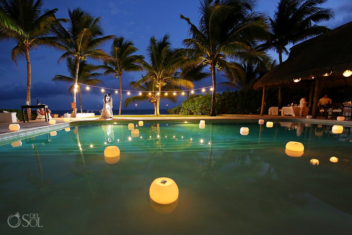 Candle Boutique floating candles poolside at hotel esencia wedding