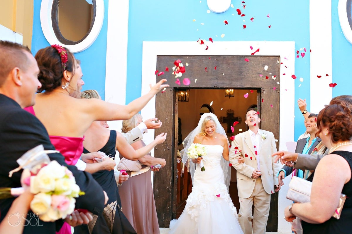 Dreams Tulum destination wedding chapel with bride and groom rose petal recessional