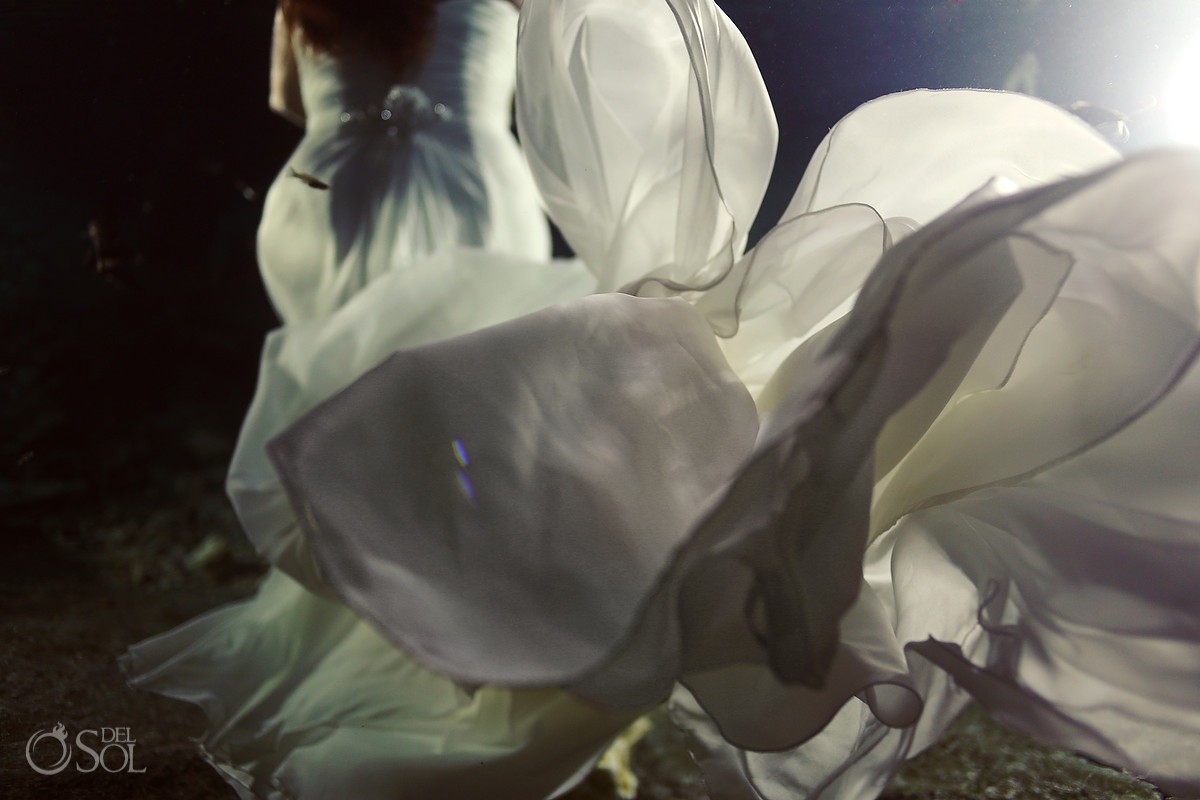 Underwater bride in a Riviera Maya cenote trash the dress photo shoot