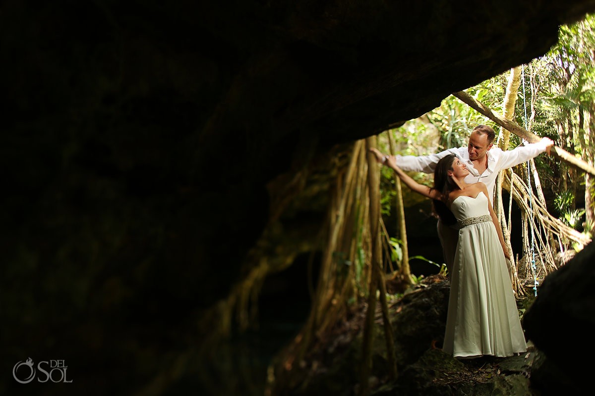 Bride and groom in a cenote trash the dress photo shoot