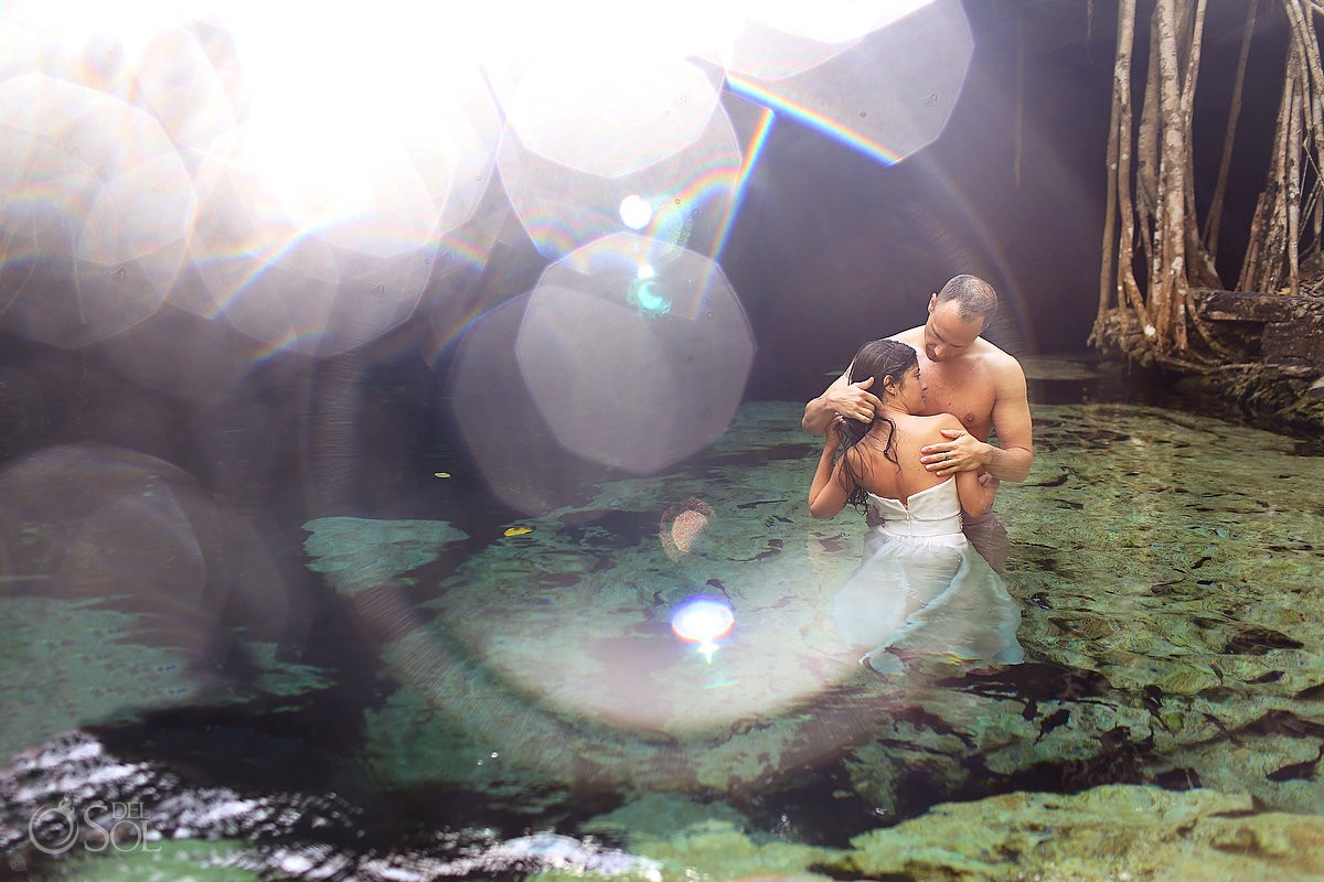 Cenote water bride and groom in a trash the dress photo shoot