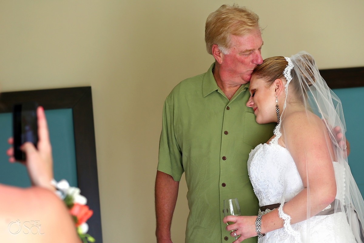 Father embracing the bride before the wedding