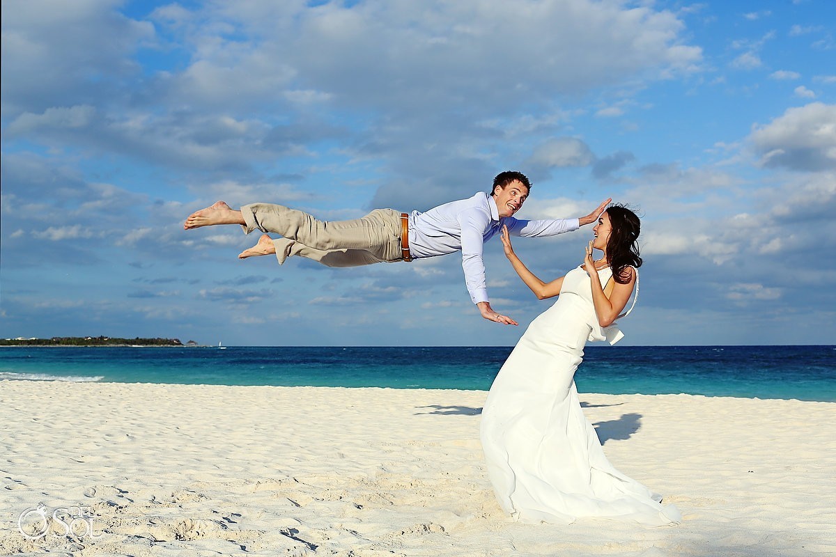 Trash the dress beach Riviera Maya jumping groom