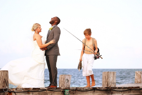 Fisherman kid photobombs bride and groom destination wedding