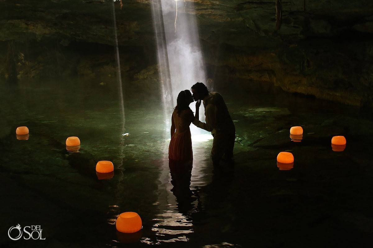 Silhouette kiss newlyweds cenote Riviera Maya