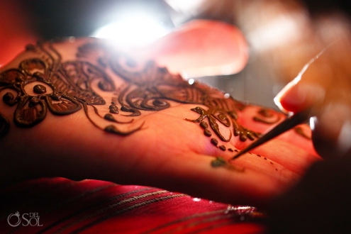 Applying mehndi on hands Hindu Indian Wedding Riviera Maya Iberostar Mexico
