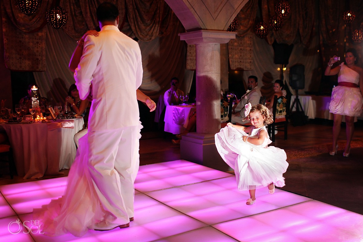 flowergirl dancing on the dance floor in wedding reception at xcaret