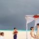 destination wedding on the beach at Iberostar cancun with rainbow