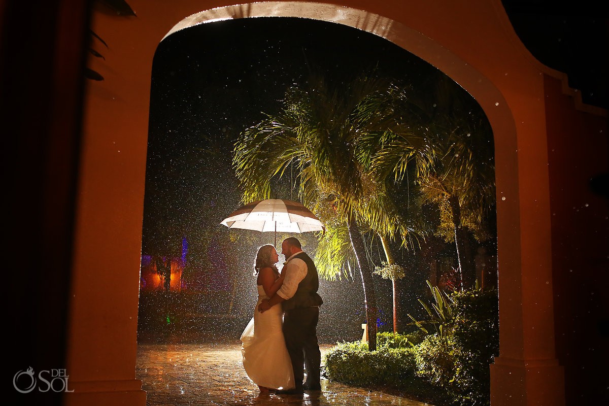bride and groom portrait in the rain at dreams tulum hotel