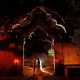 Architectural bride and groom night time wedding portrait inside the arch of Xcaret Park, Riviera Maya, Mexico