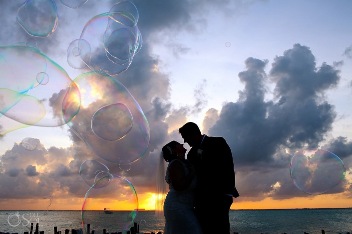 bride and groom with bubbles at beach destination wedding on isla mujeres