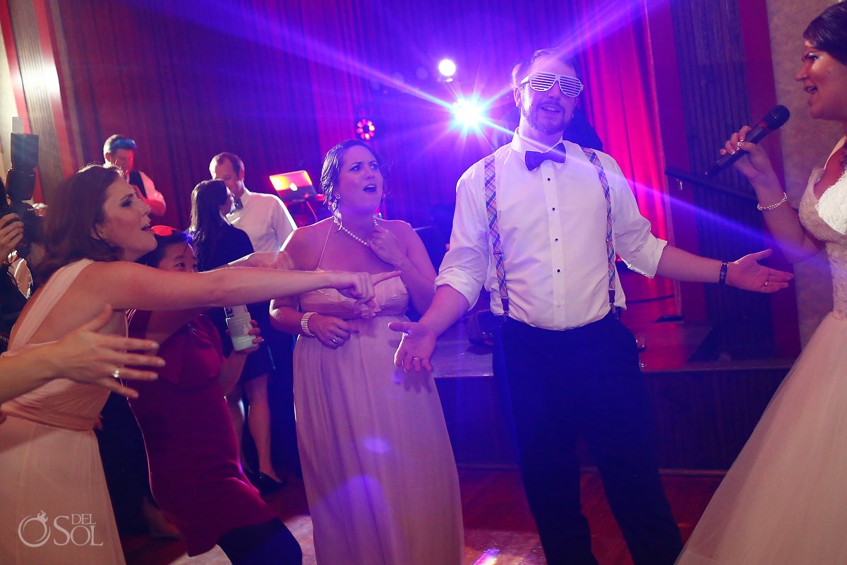 bride and groom sing at wedding reception at the armory ballroom macon georgia