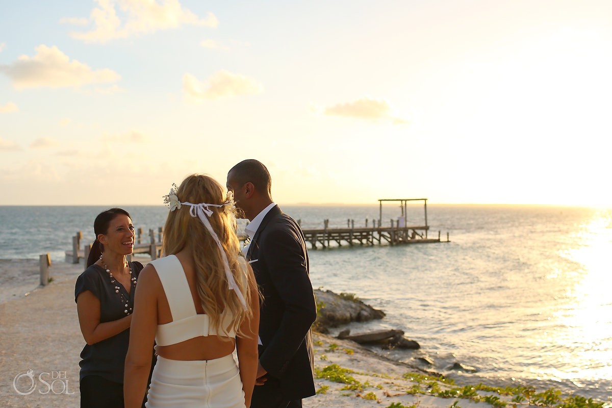 couple meet officiant Elopement ceremony pier NIZUC Resort, Cancun, Mexico.