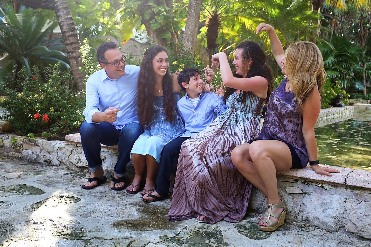 Family group laughing pointing youngest son, Portraits Belmond Maroma, Playa del Carmen, Mexico