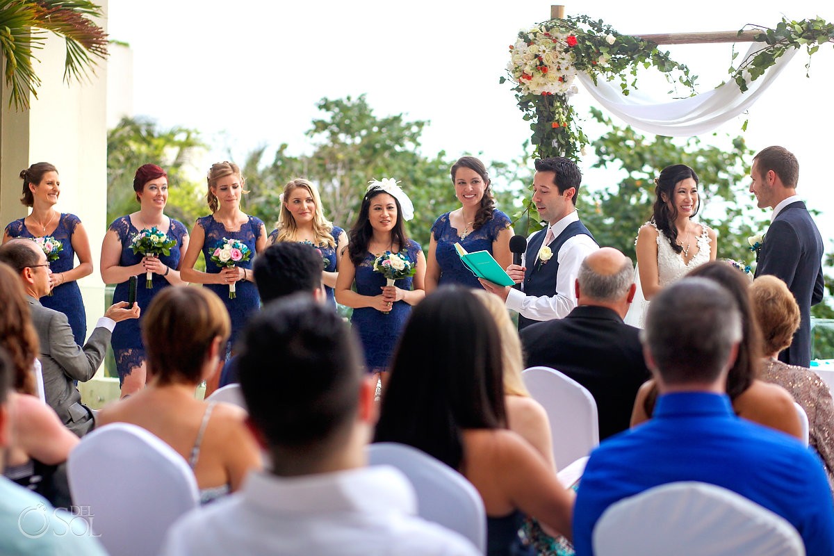 Groomsman reading during terrace wedding ceremony, Live Aqua Cancun, Mexico