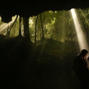 creative wedding portrait bride groom silhouette rays of light, dramatic, Cenote trash dress, cave, Riviera Maya, Mexico