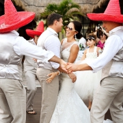 bride groom dancing surrounded groomsmen red sombreros, Wedding reception entrance Now Sapphire Tequila terrace, Puerto Morellos, Mexico