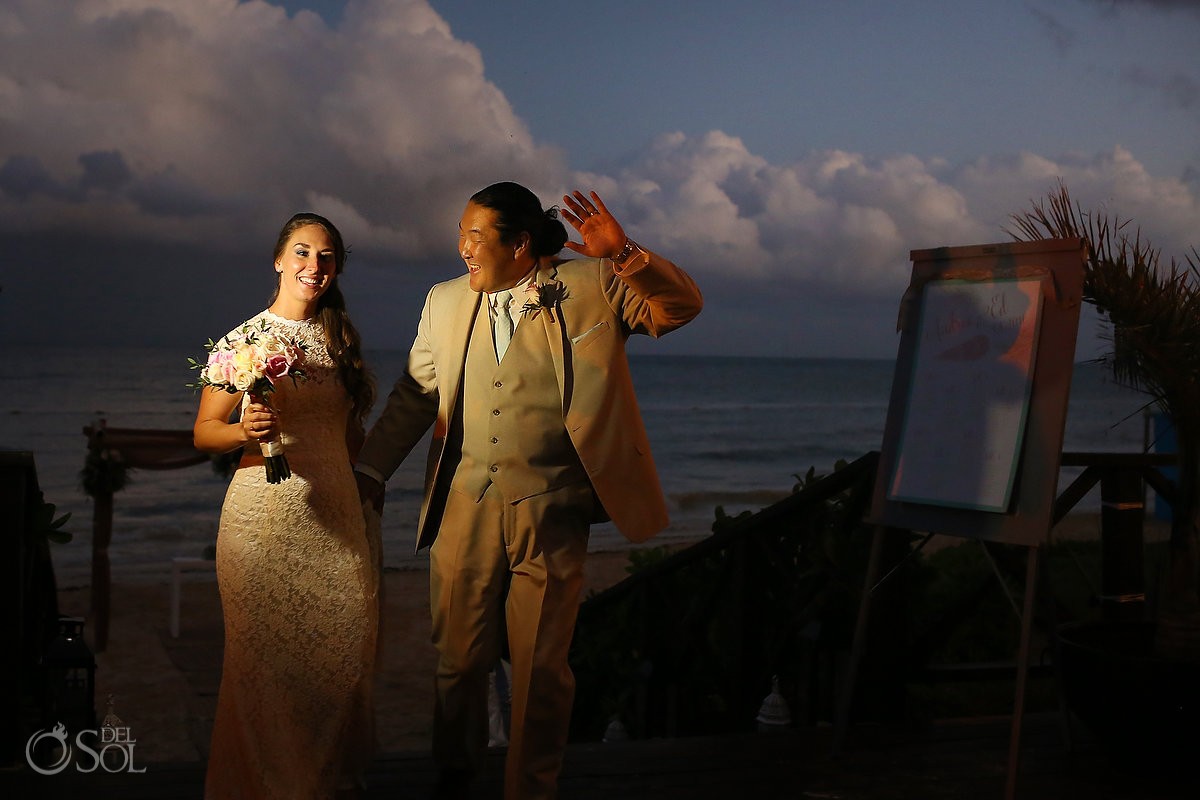bride and groom enter wedding reception at Now Sapphire Riviera Cancun