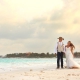 walking beach destination wedding portrait, groom wearing cowboy hat, Secrets Akumal, Riviera Maya, Mexico