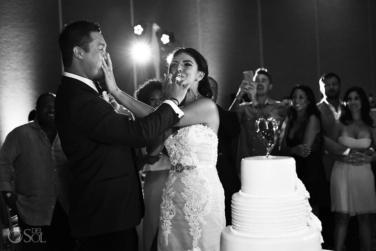 funny cake cutting smash picture Destination Wedding reception Nizuc ballroom Cancun