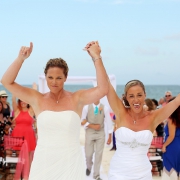same sex brides exit beach destination wedding celebrating