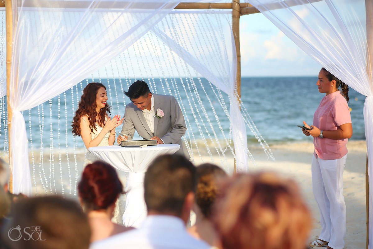 signing wedding certificate, beach Royalton Riviera Cancun, Mexico