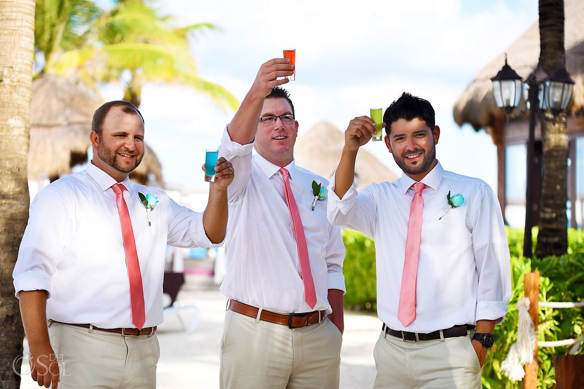 cheers! groomsmen doing colorful shots Wedding at Dreams Puerto Aventuras, Riviera Maya, Mexico