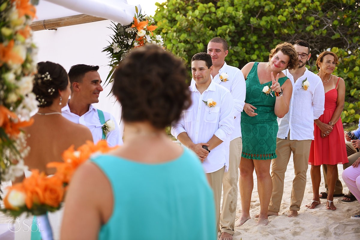 funny wedding picture groomswoman give peace sign cute beach destination wedding ceremony Grand Sirenis Riviera Maya Mexico
