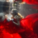 Underwater trash the dress color love Cenote trash the dress Riviera Maya Mexico