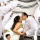 first kiss under Tallit prayer shawl Playa del Carmen Jewish Wedding Paradisus Riviera Maya Gabi Bridge