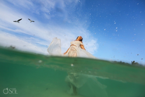 Bride enjoying life beach trash the dress Playa del Carmen México.