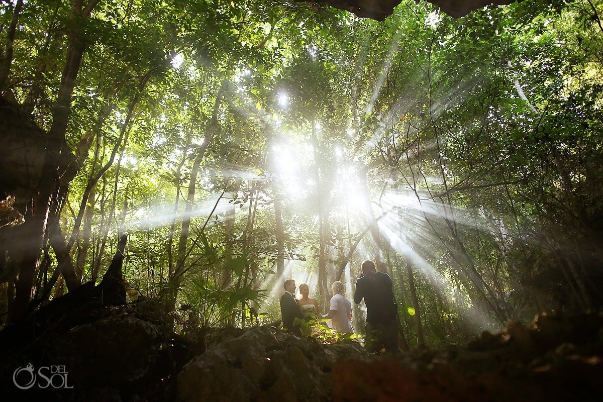 Beautiful light under jungle spiritual ceremony cenote Aktun Chen, Mexico