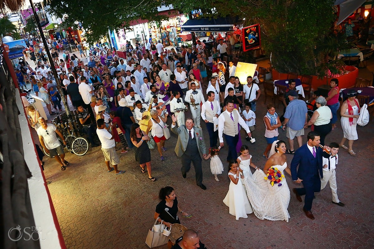 Wedding guests walking towards ceremony reception Mamita's beach club