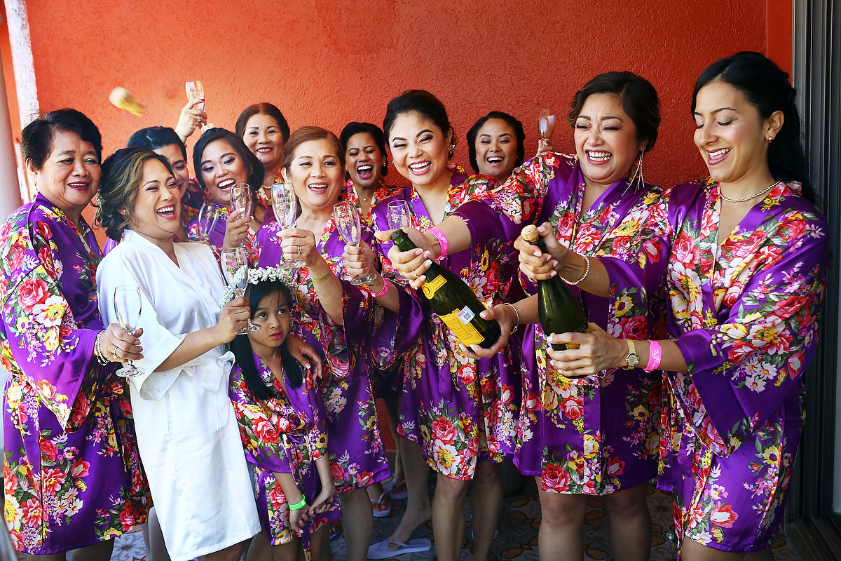 Bride and bridesmaids funny opening champagne Wedding Hard Rock Hotel Riviera Maya Mexico
