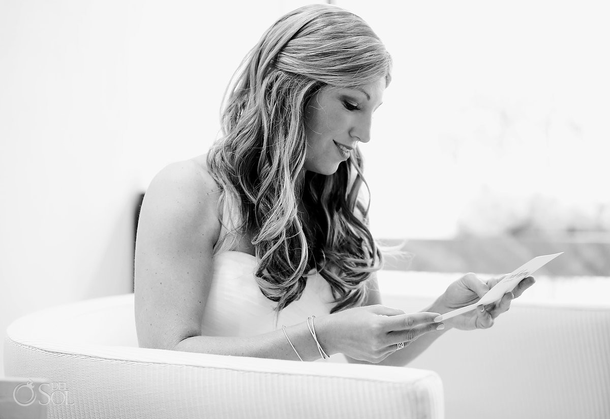 high key black and white photo of bride reading wedding day card