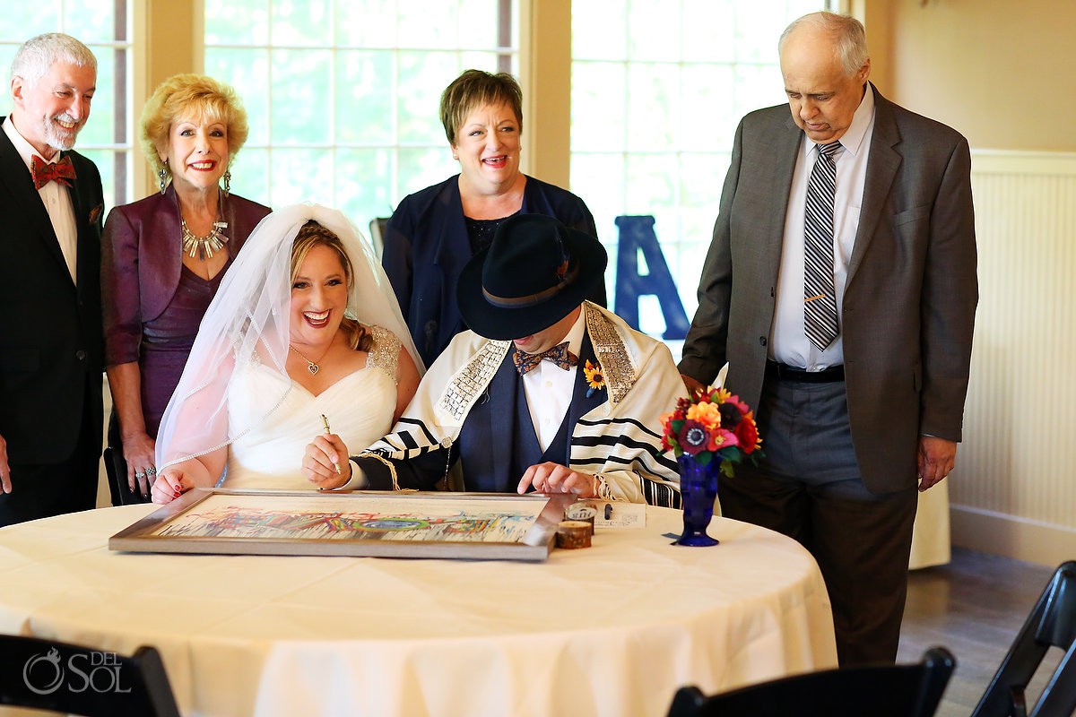 Jewish wedding ceremony Rabbi signing the ketubah Bolton Valley Resort Vermont United States