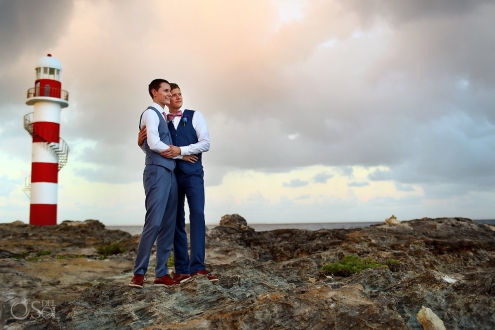 Beach wedding portrait groom and groom lighthouse Same sex Destination Wedding Hyatt Ziva Cancun Mexico