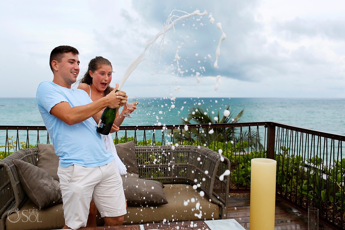 Riviera Maya Engagement proposal in tulum spraying champagne