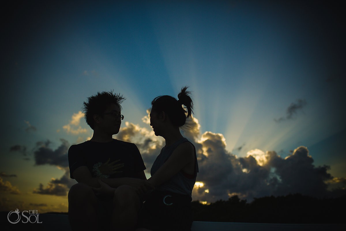 couple silhouette Cancun marriage proposal sunset boat cruise engagement Mexico.