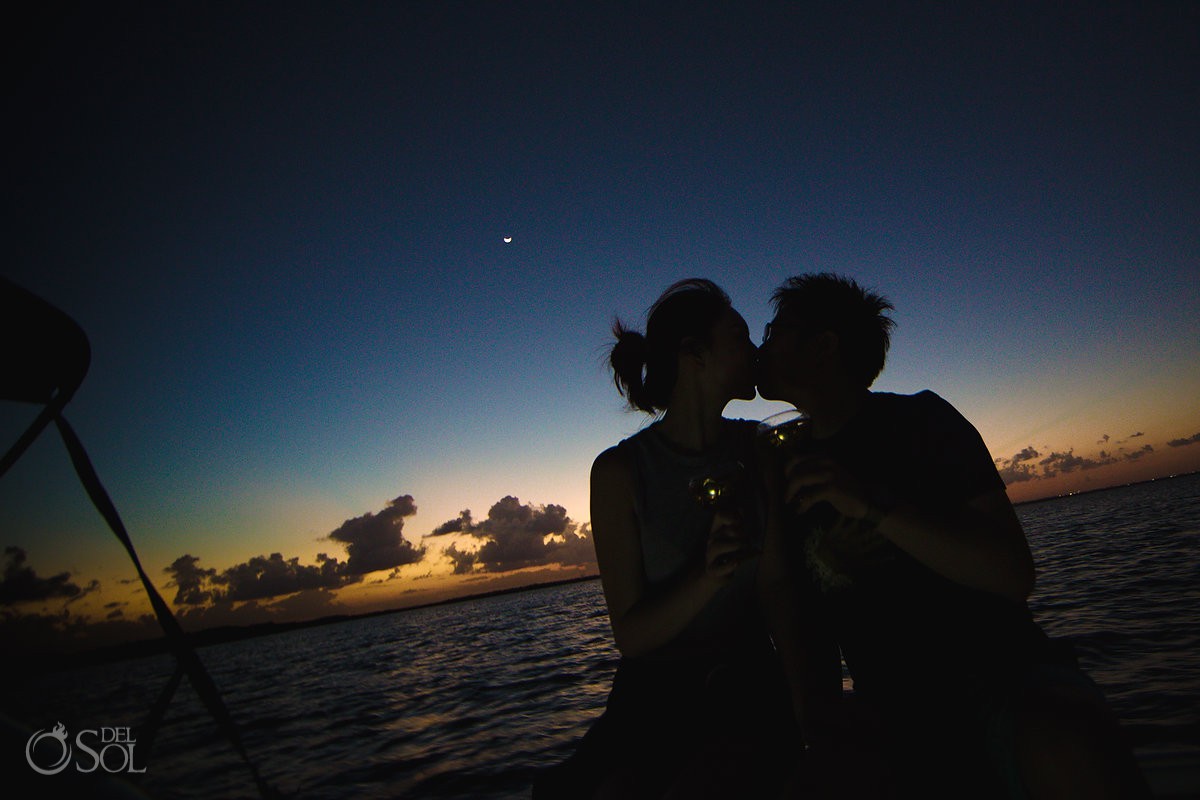 bride and groom silhouette Cancun marriage proposal sunset boat cruise engagement Mexico.