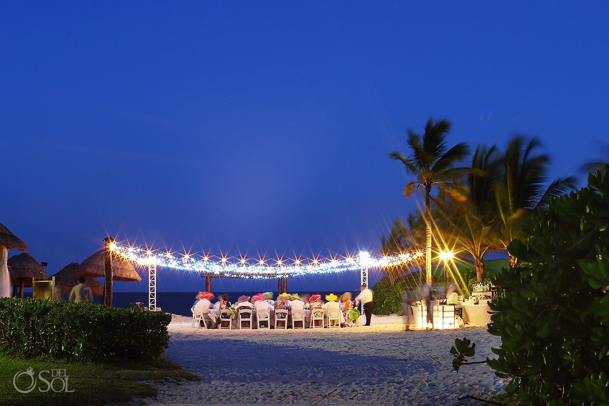 Secrets Capri beach wedding reception set up fairy lights long exposure