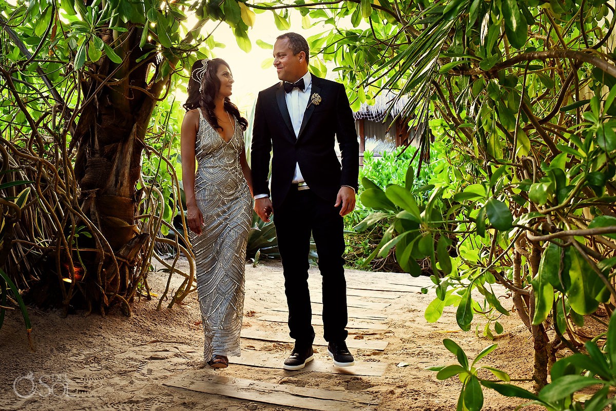 Bride and groom walking in jungle garden My Way Tulum,
