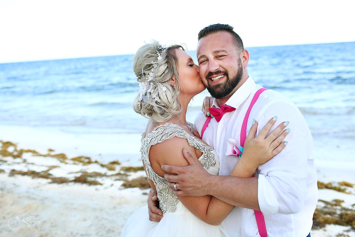 Secrets Capri South Beach Wedding bride kissing groom