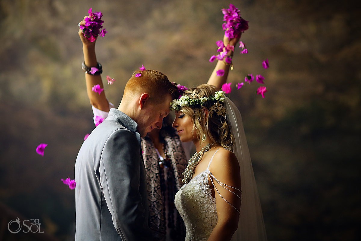 pink flower petals bride and groom cenote wedding Riviera Maya Mexico