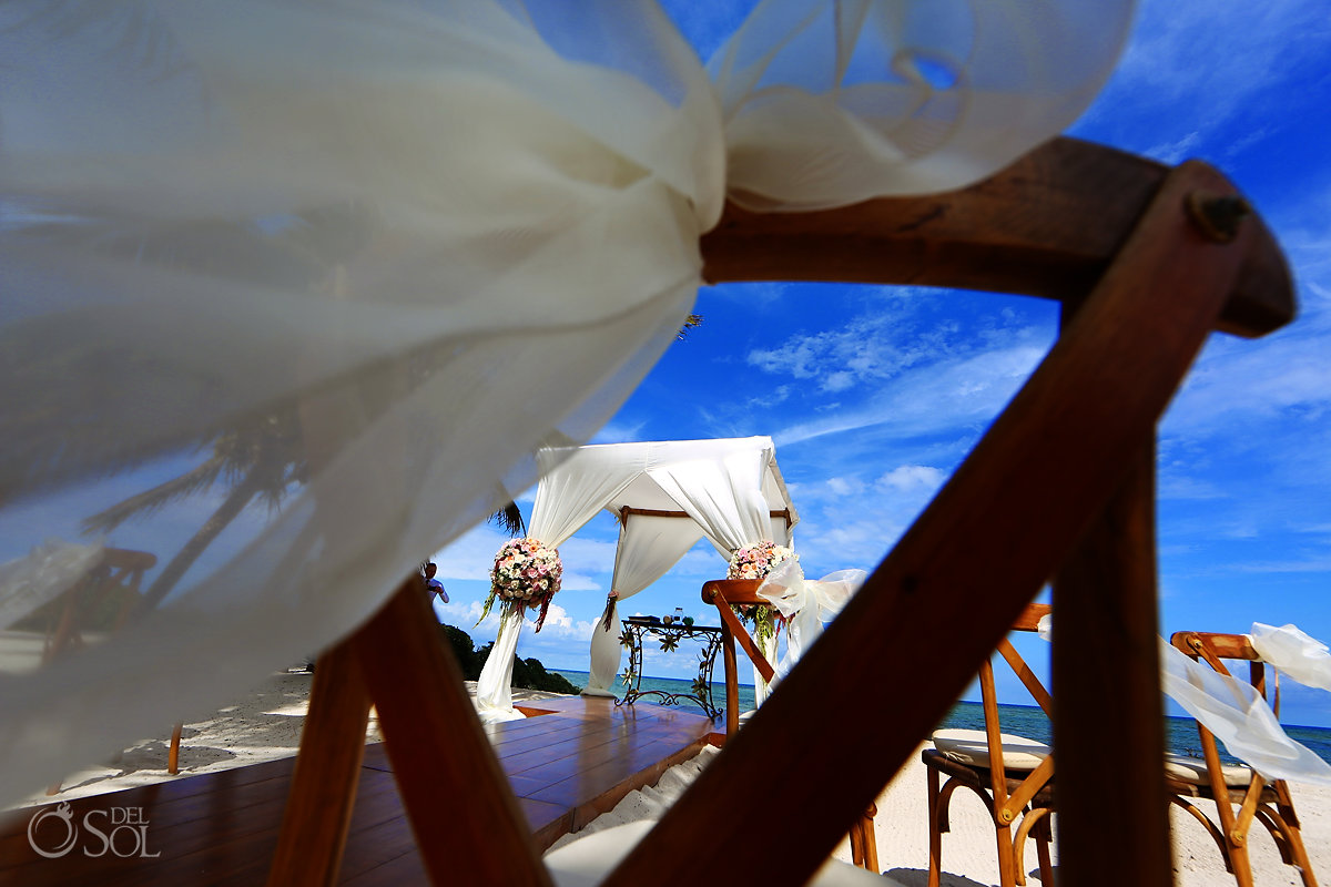 Akumal Bay Wedding beach ceremony setup pink roses