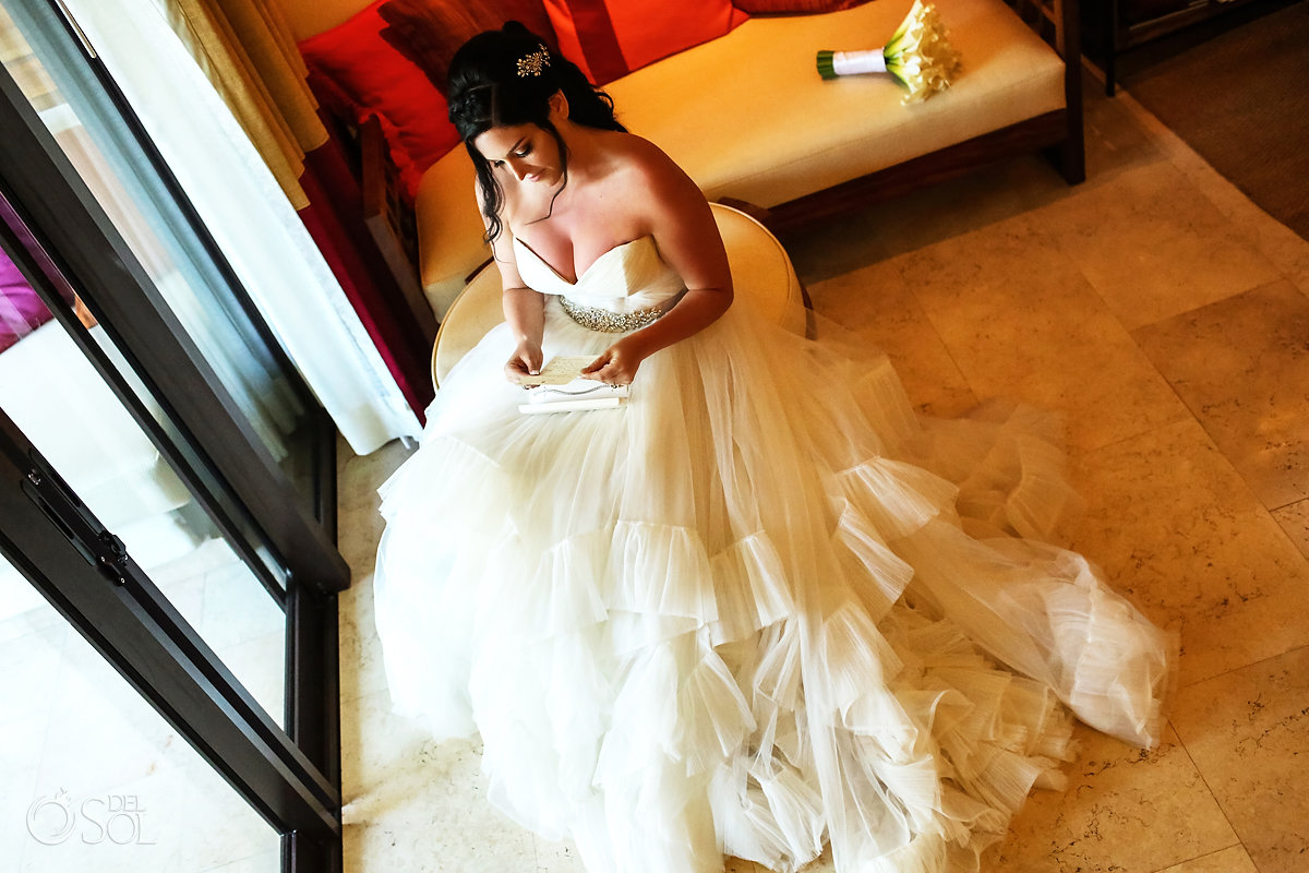 Secrets Akumal getting ready bride reading card from groom Watters Wedding Dress