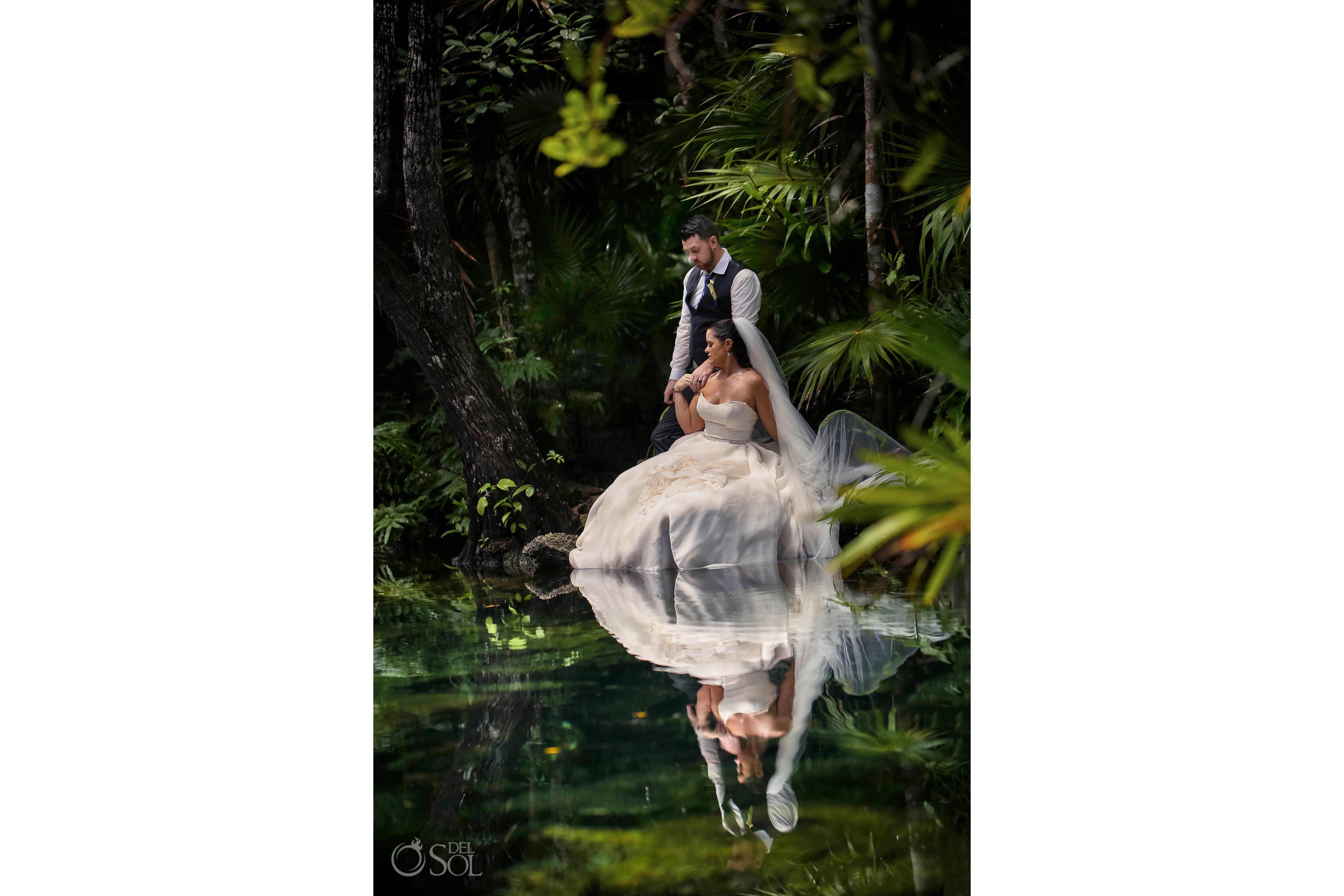 Maggie Sottero Trash the Dress couple by waters edge reflection