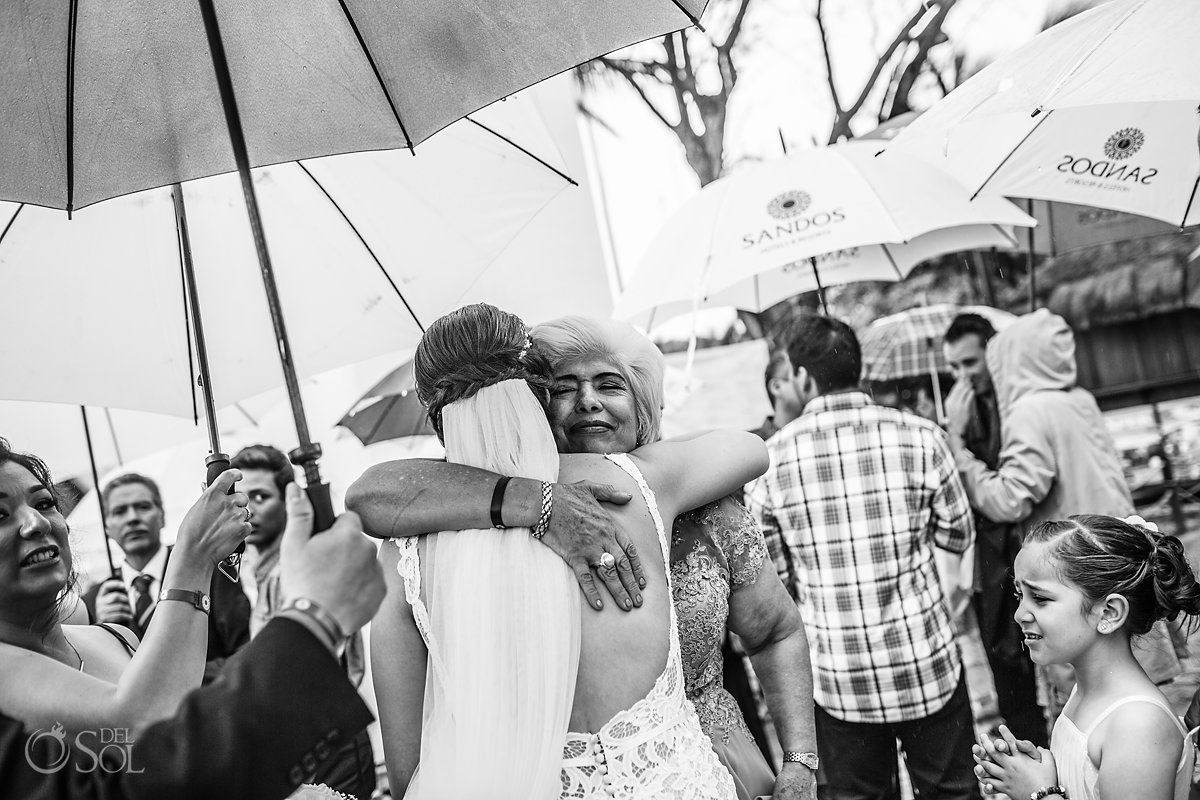 Mom Bride emotive Hug Black White Documentary Photography Caribbean Raining Umbrella Day Church Wedding Playa del Carmen Fifth Avenue