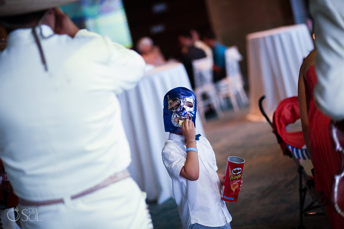 Funny wrestling Mexican mask kid eating Pringles Playa del Carmen Sandos Caracol Eco Resort Blue Church wedding