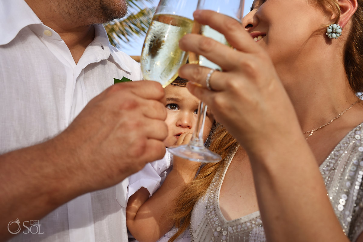 kids at weddings toddlers face between champagne glasses
